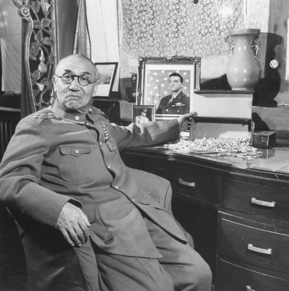 Yan Xishan in his office, Taiyuan, Shanxi Province, China, 1948; note signed portrait of Claire Chennault and box of cyanide pills intended for prevent being captured by Communists