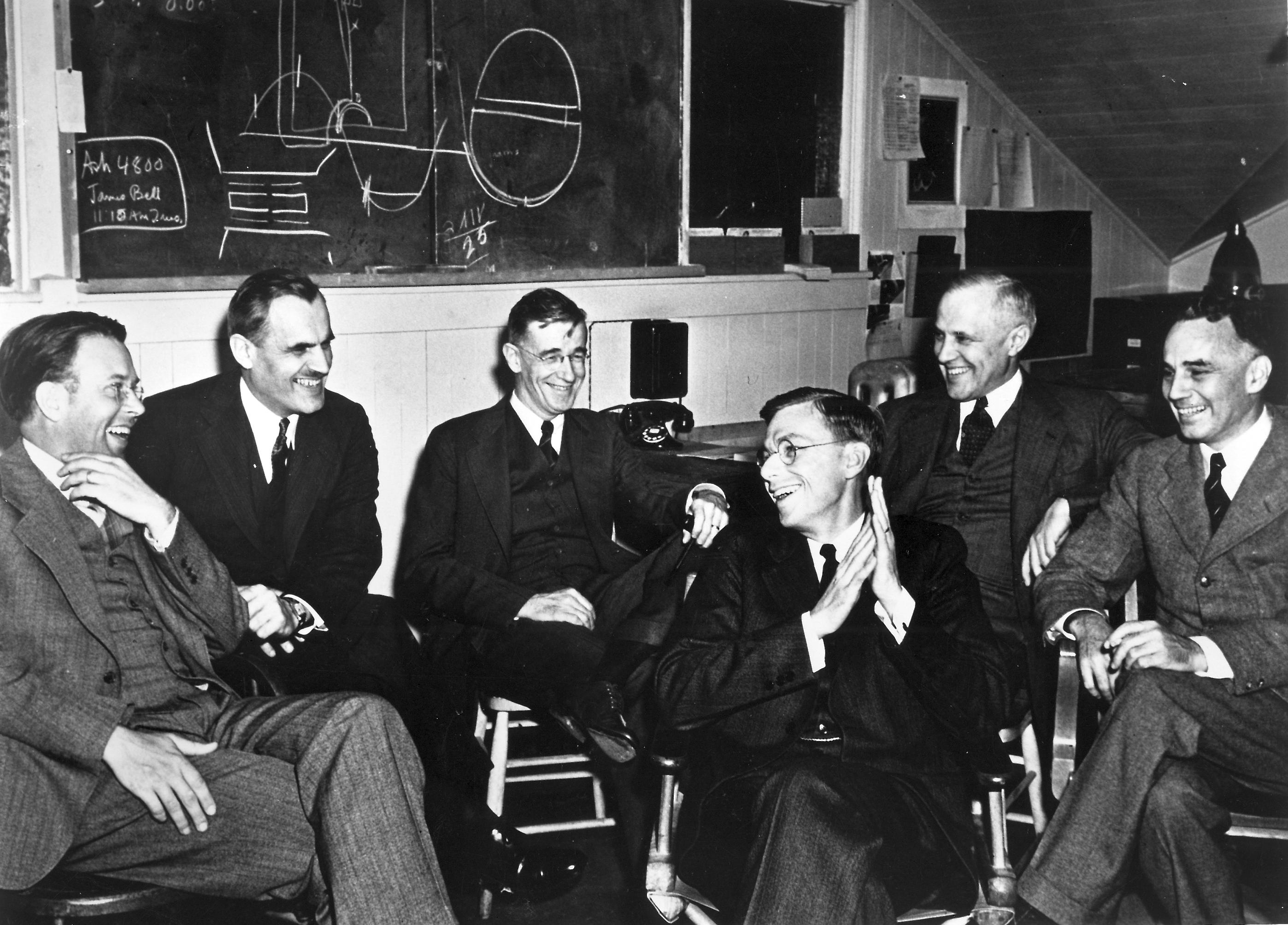 Scientists of the S-1 project (Manhattan Committee) sharing a lighter moment as they discuss the feasibility of the 184-inch cyclotron at Berkeley, California, United States, 29 Mar 1940.
