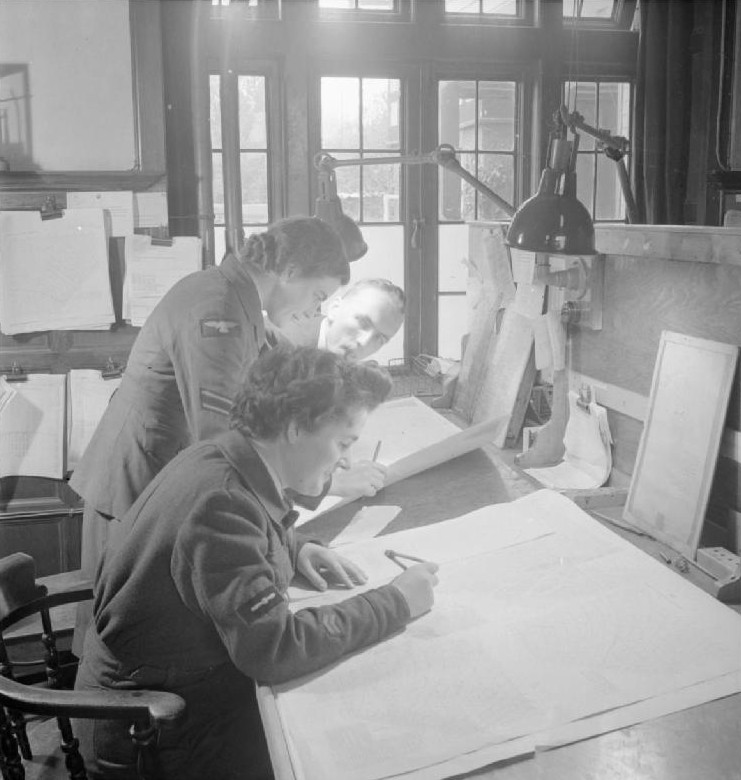 WAAF members plotting a course in an office at Prestwick Airport, Scotland, United Kingdom, 1944