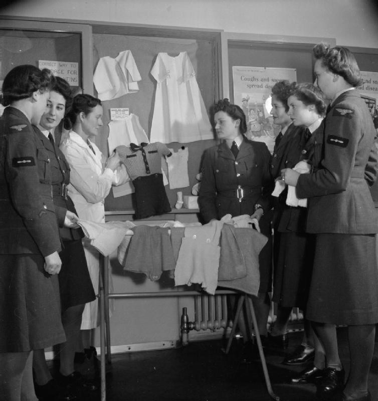 WAAF members who were training to become instructors of the RAF Educational and Vocational Training Scheme visiting a children's health clinic in Edmonton, London, England, United Kingdom, date unknown