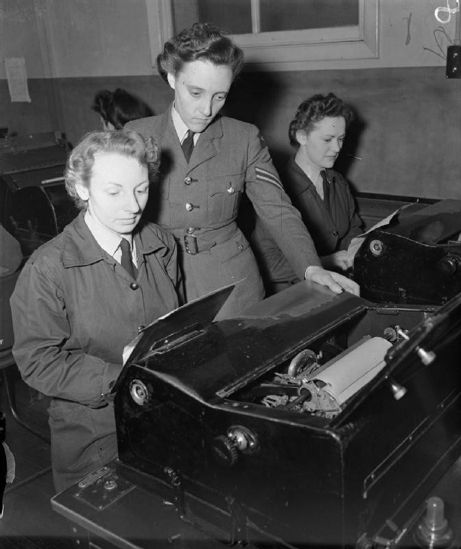 WAAF teleprinter operators receiving messages for onward transmission by wireless telegraphy, Headquarters No. 60 (Signals) Group, RAF Leighton Buzzard, Bedfordshire, England, United Kingdom, date unknown