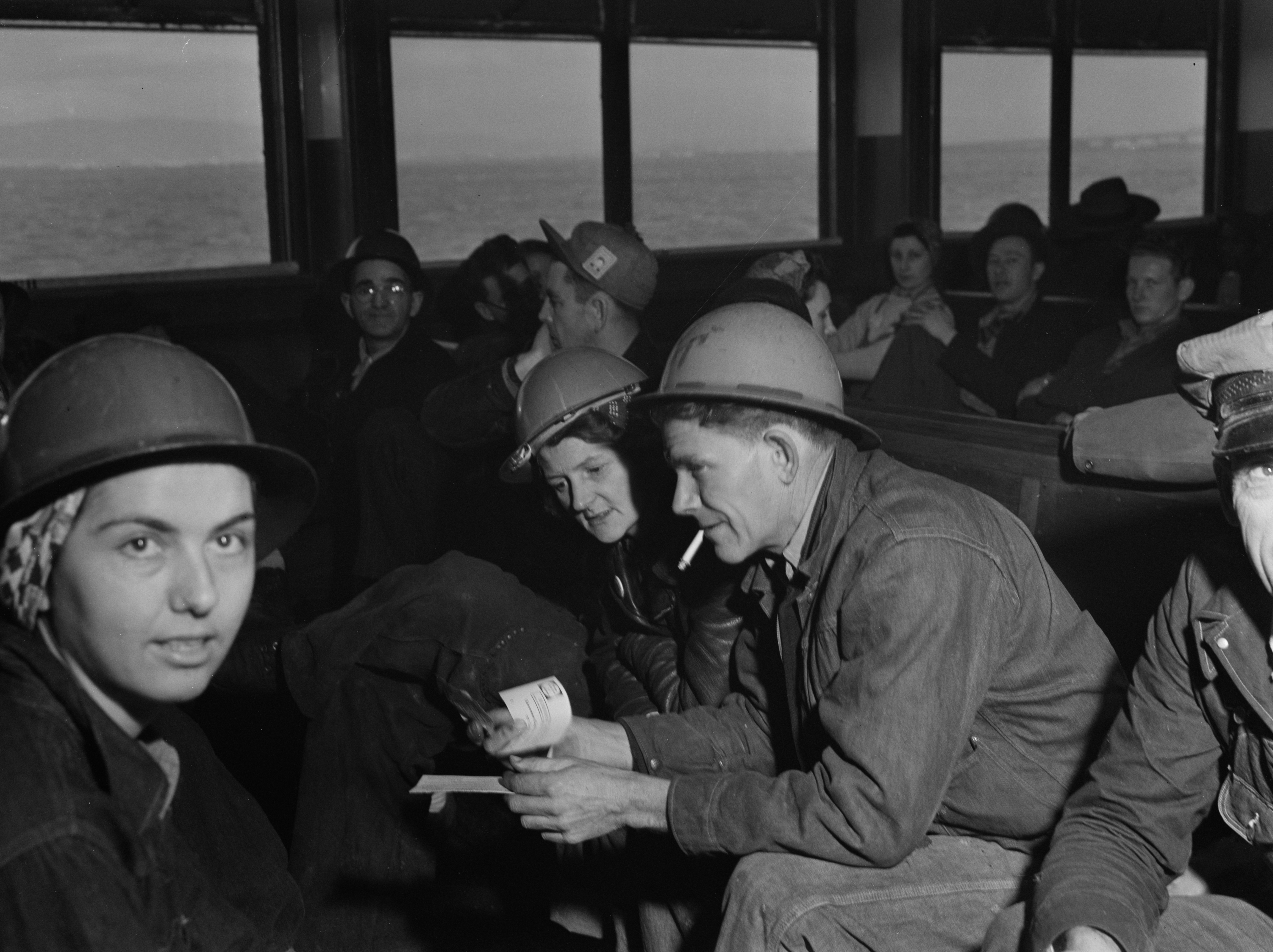 Kaiser Richmond Shipyards workers aboard a ferry between San Francisco and Richmond, California, United States, Feb 1943