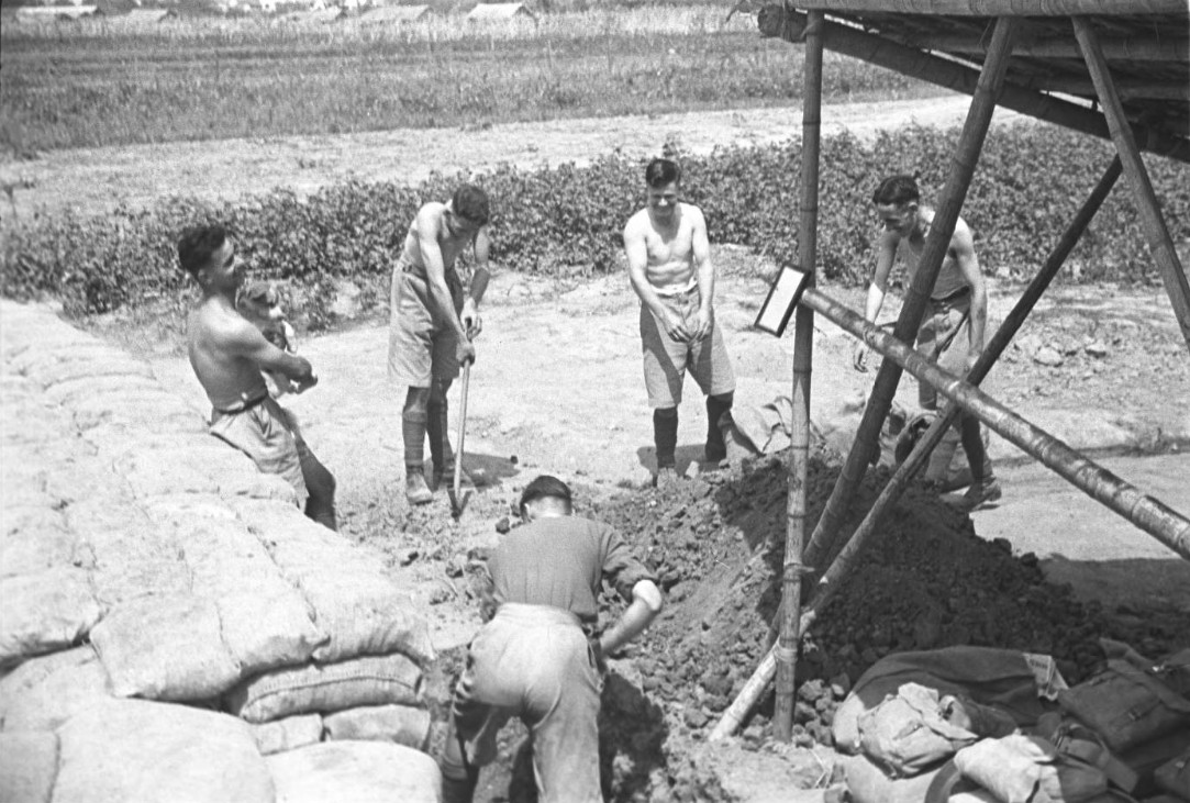 Western soldiers filling sand bags, Shanghai International Settlement, China, mid-1937