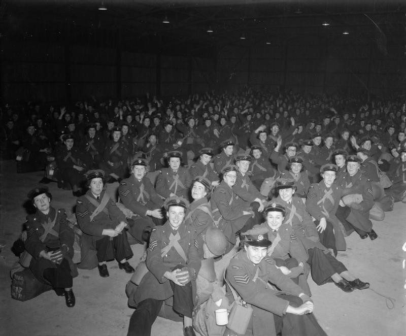 WAAFs gathering in a drill shed awaiting transport to South-East Asia Command, RAF West Kirby, Cheshire, England, United Kingdom, 1940s