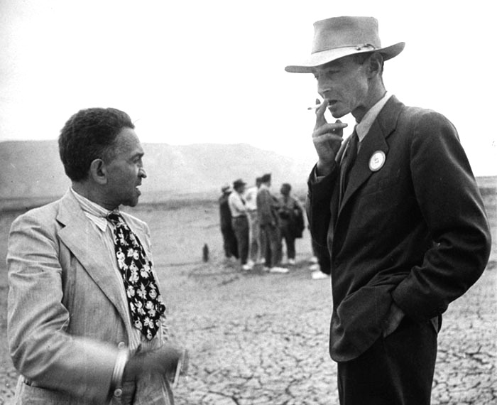 William Laurence and J. Robert Oppenheimer at the Trinity test site during a press visit, Sep 1945.
