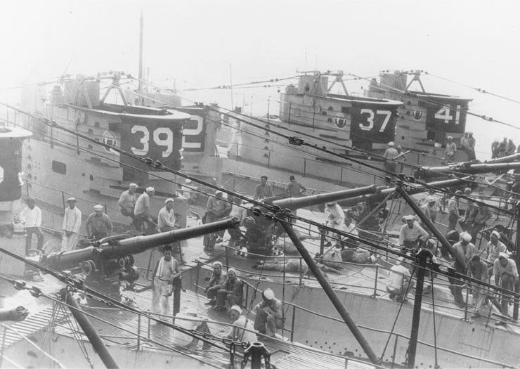 USS S-36, USS S-39, USS S-37, and USS S-41 moored alongside of USS Canopus, Qingdao, Shandong Province, China, circa 1930; note Chinese civilians mingling with US sailors