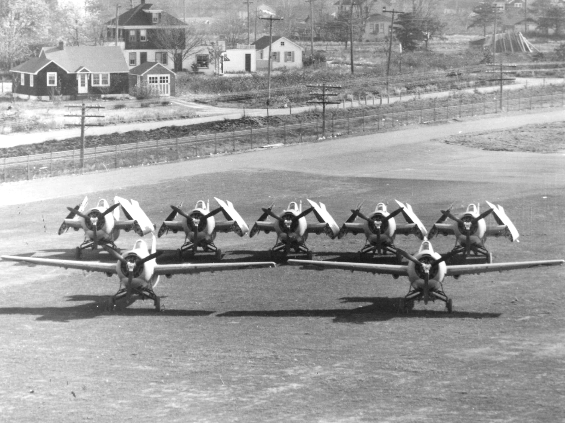 Grumman factory photo showing how five of the new F4F-4 “Sto-Wing” Wildcat fighters fit in the same space as two of the previous F4F-3 rigid wing fighters, Bethpage, New York, 1941. In practice, the ratio was more 3-to-2