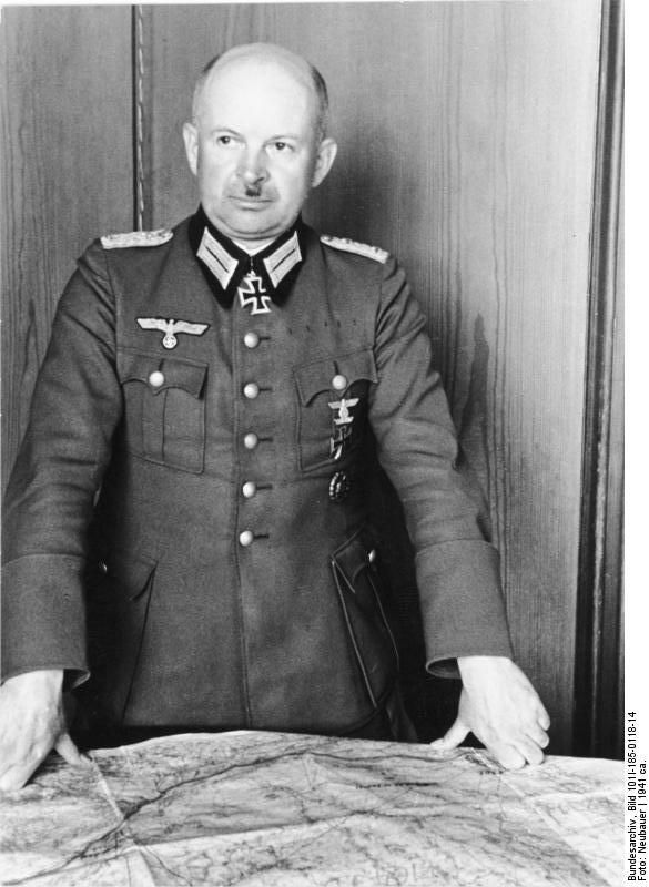 Colonel Kurt Zeitzler standing over a map, Yugoslavia, circa 1941