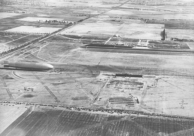 German airship Graf Zeppelin seen moored to a temporary mooring mast at Mines Field, Inglewood, California after arriving from Japan on her around-the-world flight, 26 Aug 1929. Photo 2 of 2.