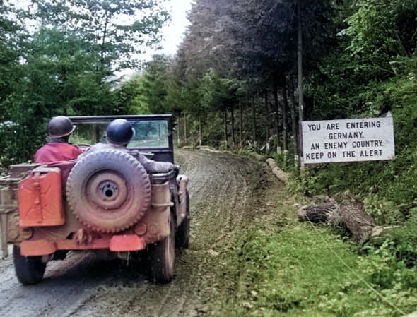 A US Army Jeep preparing to cross the border into Germany, Oct 5 1944. [Colorized by WW2DB]