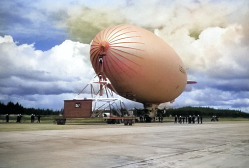 US Navy airship K-87 of Airship Patrol Squadron ZP-33 at Outlying Landing Field at Quillayute, Washington, United States, Sep 8, 1944. Photo 2 of 2. [Colorized by WW2DB]