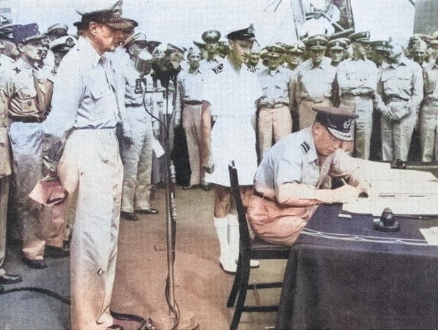 Air Vice-Marshal L.M. Isitt signing the surrender instrument on behalf of the Dominion of New Zealand aboard USS Missouri, Tokyo Bay, Japan, 2 Sep 1945 [Colorized by WW2DB]