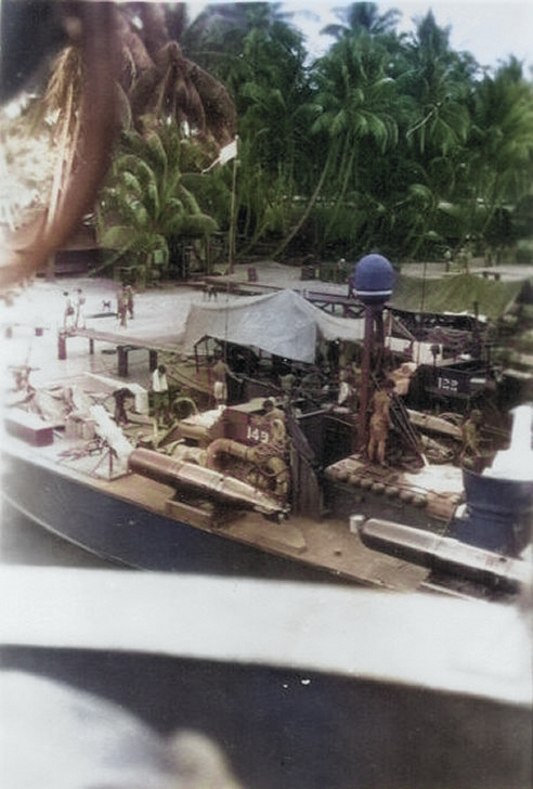 Elco 80-foot torpedo boats PT-149 and PT-122 at Tulagi, Solomon Islands, 1943. Note Mark XIII torpedoes and radar dome atop the mast. [Colorized by WW2DB]