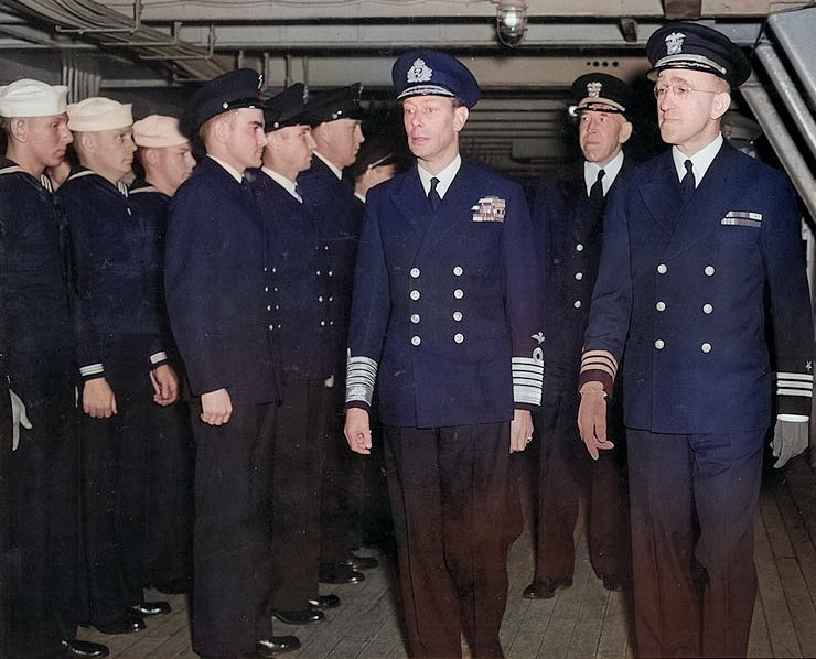 King George VI aboard USS Ancon accompanied by US officers Rear Admiral John Hall, Jr. and Commander Mead Pearson, 25 May 1944 [Colorized by WW2DB]