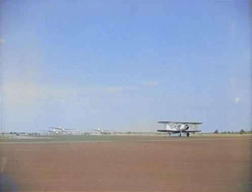 N3N Canary aircraft towing three LNS-1 gliders, Page Field, Parris Island, South Carolina, United States, May 1942 [Colorized by WW2DB]