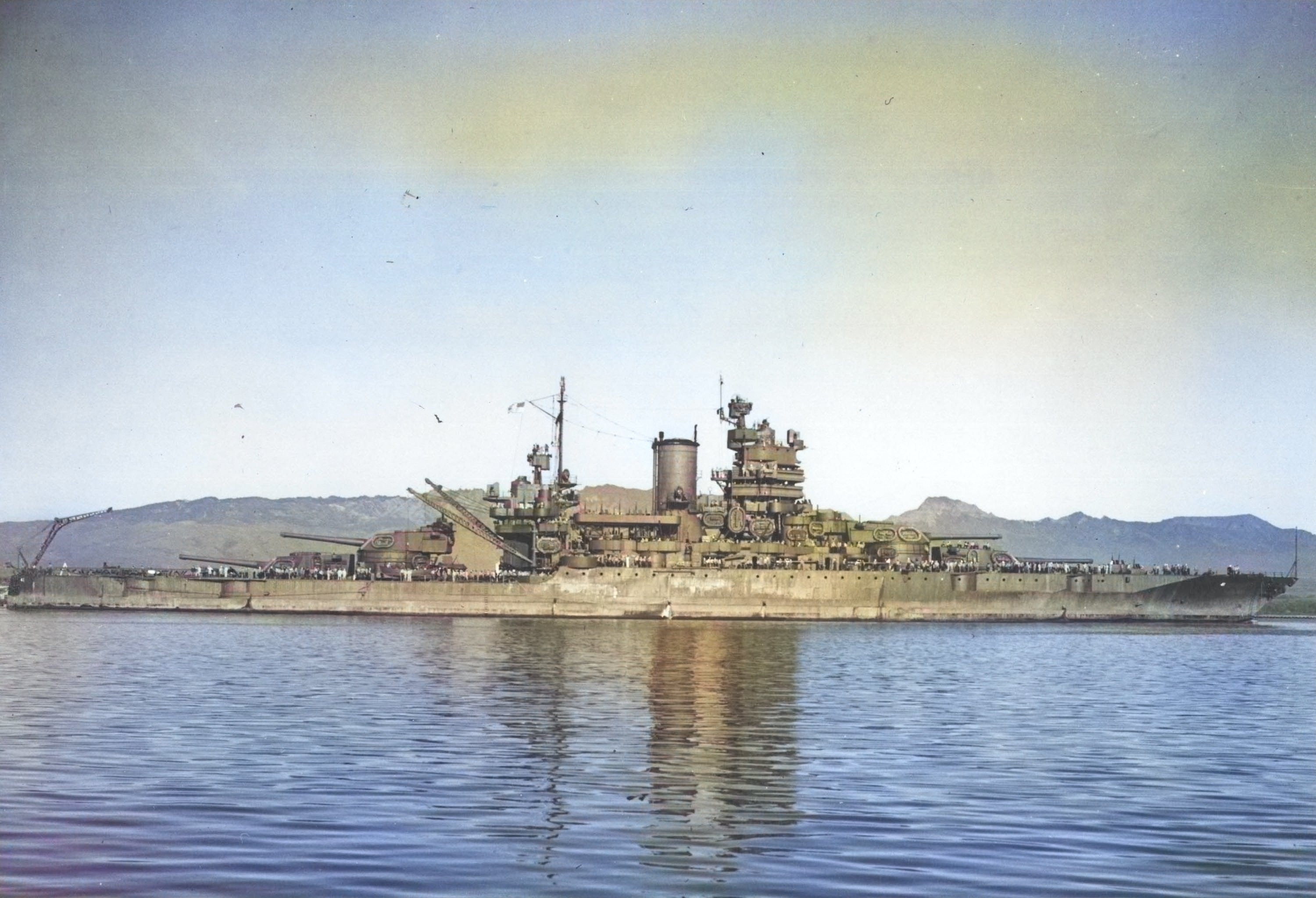 Battleship USS Mississippi entering Pearl Harbor, Hawaii, 2 Mar 1943. [Colorized by WW2DB]