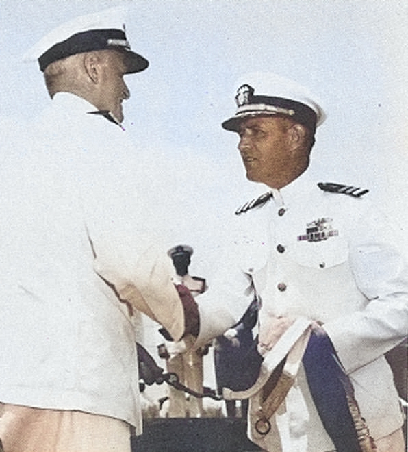 Admiral Chester Nimitz presenting the Presidential Unit Citation pennant to USS Bowfin commanding officer Commander John Corbus at Pearl Harbor, Hawaii, Jul 1944. [Colorized by WW2DB]