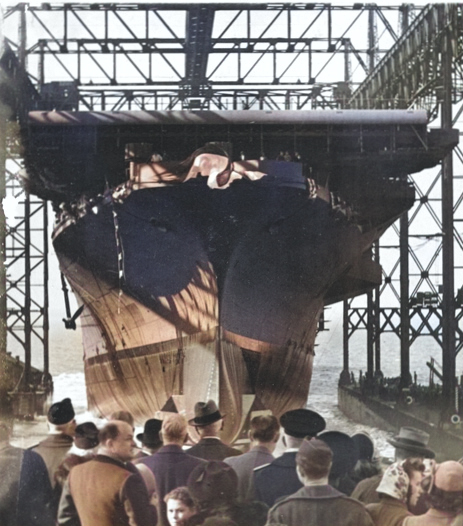 Essex-class carrier Ticonderoga sliding down the ways during her launch at Newport News, Virginia, United States, 7 Feb 1944. [Colorized by WW2DB]