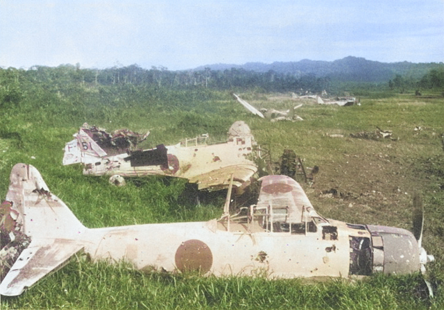 Destroyed Japanese A6M Zero fighters near Lae, New Guinea, 1943 [Colorized by WW2DB]