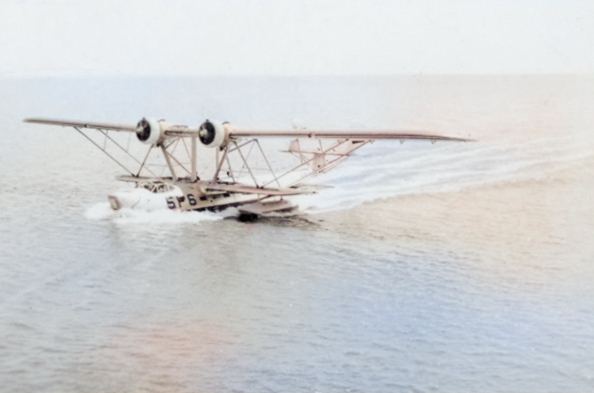 P2Y-2 aircraft of US Navy squadron VP-5F taxiing on water, possibly at Fleet Air Base Coco Solo of Panama Canal Zone, 1936 [Colorized by WW2DB]