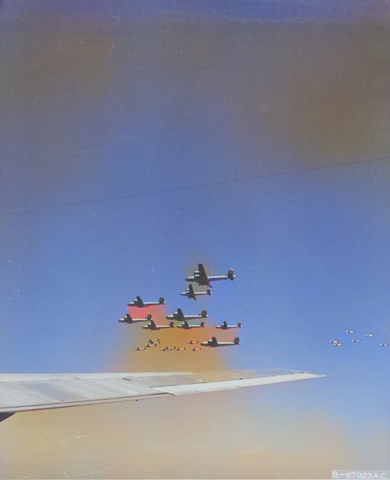 A formation B-29 Superfortress bombers in flight toward Japan, 1945 [Colorized by WW2DB]