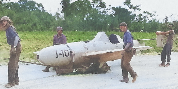 American troops moving captured MXY7 Ohka aircraft I-10, Kadena airfield, Okinawa, Japan, Apr 1945 [Colorized by WW2DB]