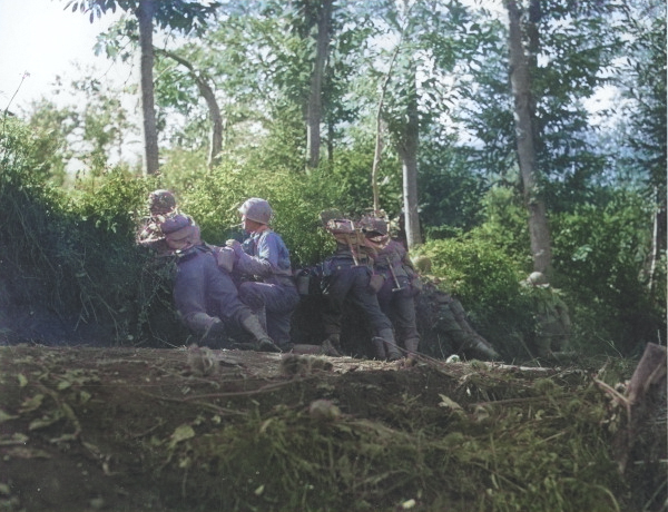 Japanese-American soldiers of the US 100th Infantry Battalion taking position behind an embankment during mock maneuvers, Italy, 12 Oct 1943 [Colorized by WW2DB]