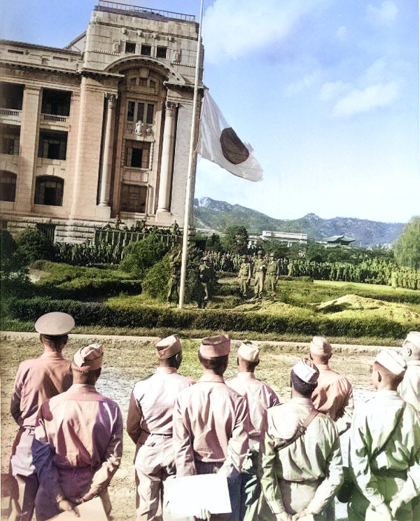 Japanese flag being lowered during the surrender ceremony at the General Government Building, Seoul, Korea, 9 Sep 1945 [Colorized by WW2DB]