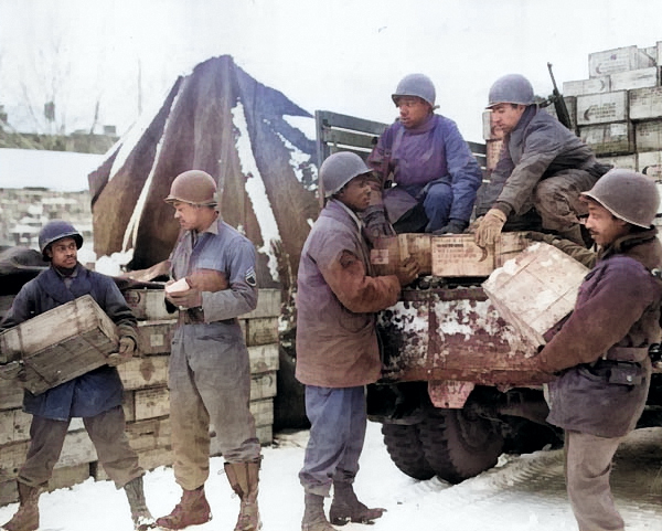 African-American US Army soldiers of 4185th Quartermaster Service Company unloading rations from a truck, Liege, Belgium, 1944 [Colorized by WW2DB]