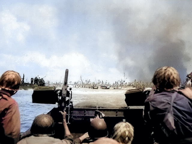 US Army troops off the Kwajalein invasion beach, Marshall Islands, 1 Feb 1944 [Colorized by WW2DB]