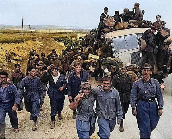 Axis prisoners of war are herded out of the city as Allied armies enter Tunis, Tunisia, May 1943 [Colorized by WW2DB]