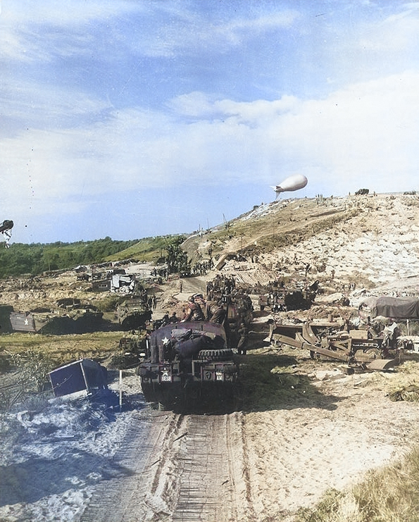 US Army vehicles moved inland from a Normandy invasion beach, Jun 1944 [Colorized by WW2DB]