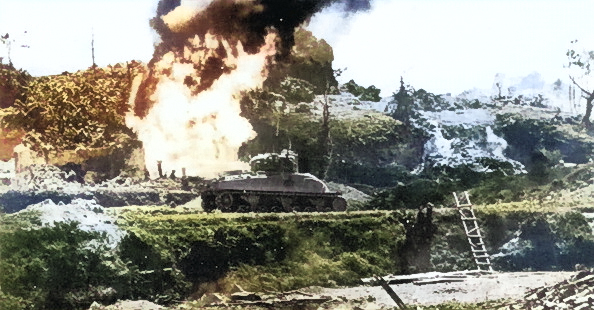 American flamethrower tank attacking a Japanese-held cave, Okinawa, Japan, circa Apr-Jun 1945 [Colorized by WW2DB]