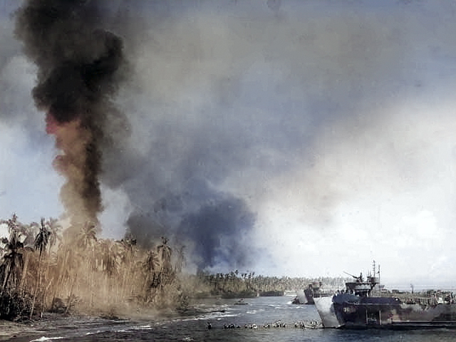 First wave of American troops storming ashore from amphibious landing craft, Leyte, Philippine Islands, 20 Oct 1944, photo 3 of 3 [Colorized by WW2DB]