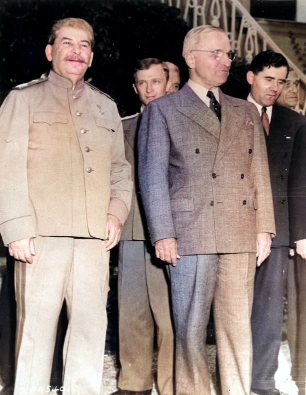 Joseph Stalin and Harry Truman during the Potsdam Conference, Germany, 20 Jul 1945; note V. N. Pavlov and Andrei Gromyko in background [Colorized by WW2DB]