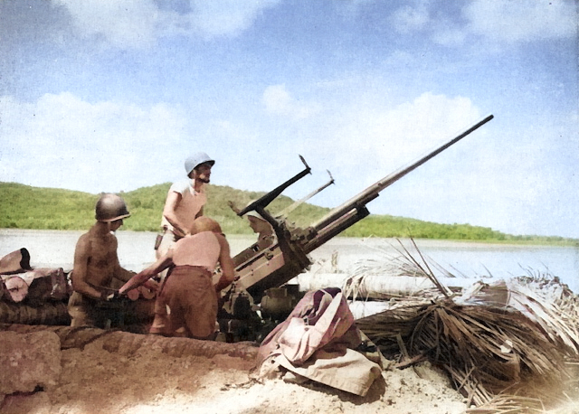 Men of Battery F, 70th Coast Artillery of the US Army manning a 37-mm anti-aircraft gun at Wickham Anchorage, New Georgia, Solomon Islands, 1943 [Colorized by WW2DB]