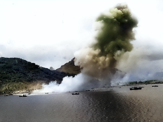 Smoke rising from the Japanese naval base at Dublon Island, Truk Atoll, Caroline Islands, 29-30 Apr 1944 [Colorized by WW2DB]