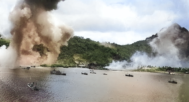 Japanese naval base, warships, and fishing boats at Dublon Island under American aerial attack, Truk Atoll, Caroline Islands, 16 Feb 1944, photo 1 of 2 [Colorized by WW2DB]