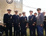 Lieutenant F. M. Edwards, Commander N. M. Carlson, Commander T. A. Gregg, Lieutenant Commander H. D. Lane, and Commander A. E. Wills at the Double Ten Day celebrations, Shanghai Race Course, China, 10 Oct 1945