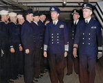 King George VI aboard USS Ancon accompanied by US officers Rear Admiral John Hall, Jr. and Commander Mead Pearson, 25 May 1944