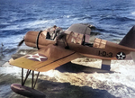 OS2U Kingfisher aircraft recovered alongside battleship Arizona, near US Territory of Hawaii, 6 Sep 1941, photo 1 of 2; note flag just forward of main pontoon