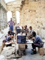 A company of African American soldiers of the US Army working at a makeshift office located at an ancient Neptune temple in Italy, 22 Sep 1943