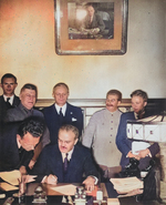 Molotov signing the German-Soviet non-aggression pact, Moscow, Russia, 23 Aug 1939; Shaposhnikov, Ribbentrop, and Stalin in back row