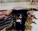 An American surgeon operated on a soldier wounded by Japanese sniper fire, Bougainville, 13 Dec 1943