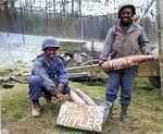 African American US Army soldiers T/5 William E. Thomas and Private First Class Joseph Jackson marking artillery shells as Easter presents for Adolf Hitler, 10 Mar 1945