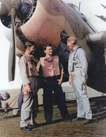 Aviation Radioman 1st Class E. L. Feehan, Aviation Ordnanceman 2nd Class S. J. Pocotny, and Lieutenant Commander J. J. Lynch aboard USS Coral Sea, 30 Oct 1943