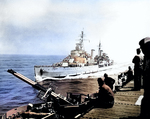 British cruiser HMS Belfast alongside American light carrier USS Bataan off the coast of Korea, 27 May 1952; note Bataan