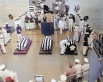 Aboard USS Canberra, US Navy Hospitalman William R. Charette selecting the Unknown Serviceman of WW2 for burial in Arlington National Cemetery; off Virginia, United States, 26 May 1958