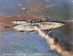 Aerial photo of battleship Colorado in a harbor, 2 May 1927; note three large and five small harbor tugs nearby