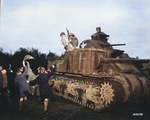 Sgt. Hiram Prouty of US 175th Infantry Regiment dressed as Santa Claus during the Christmas season, arriving on a M3 medium tank, Perham Down, England, United Kingdom, 5 Dec 1942